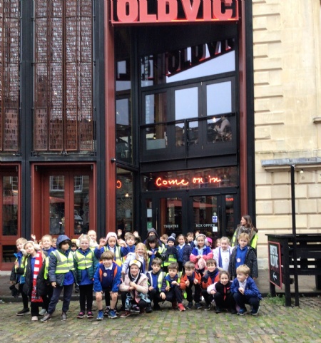 primary school children outside a theatre